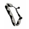 Black and white woven beaded bracelet with an adjustable pull-string closure.
