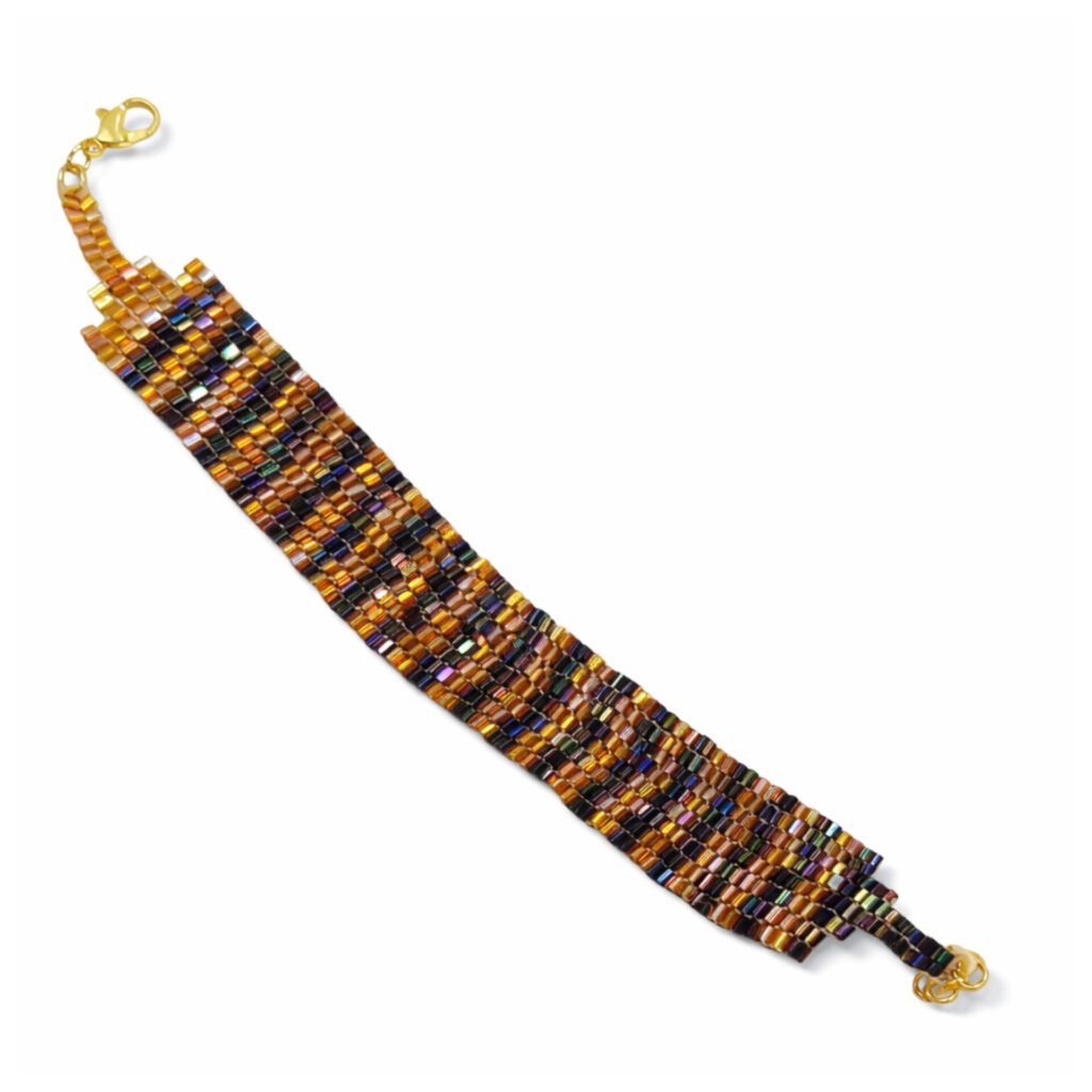 Aurora Beads Wide Bracelet featuring multiple rows of iridescent metallic beads in amber, purple, and green with a gold lobster clasp.