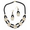 Classic Noir Pearl Necklace set featuring a 44.5 cm woven black and white bead necklace and matching 6.5 cm drop earrings with a gold clasp.