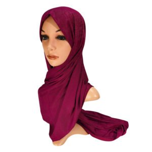 A side view of a mannequin wearing a beige Bamboo Jersey Rib Hijab with a fine vertical ribbed texture draped elegantly over the shoulders.