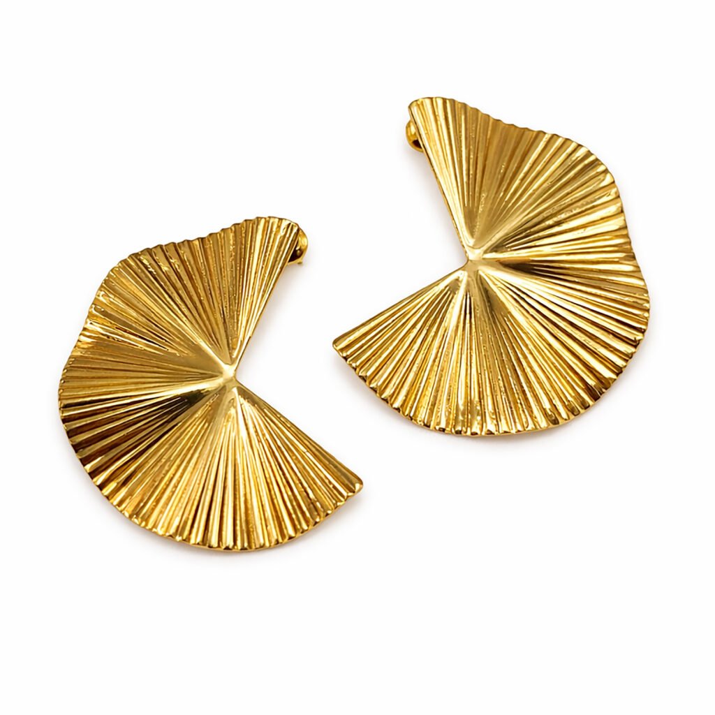 A pair of Sunray Studs Gold Earrings featuring a fan-shaped design with a radiant ribbed texture and a polished gold finish on a white background.