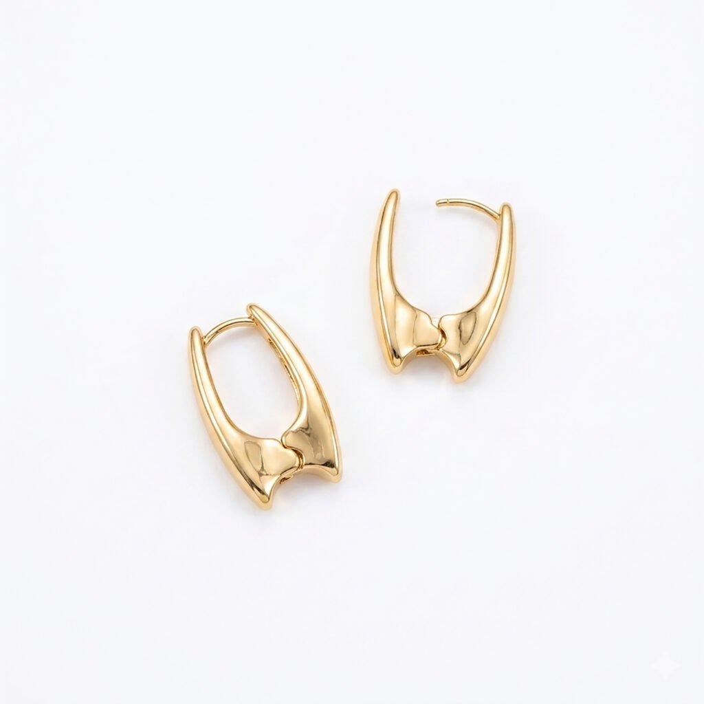 A pair of gold Urbane Hoops from the Cwen Collection featuring a sculpted U-shaped geometric design and a secure latch closure on a white background.