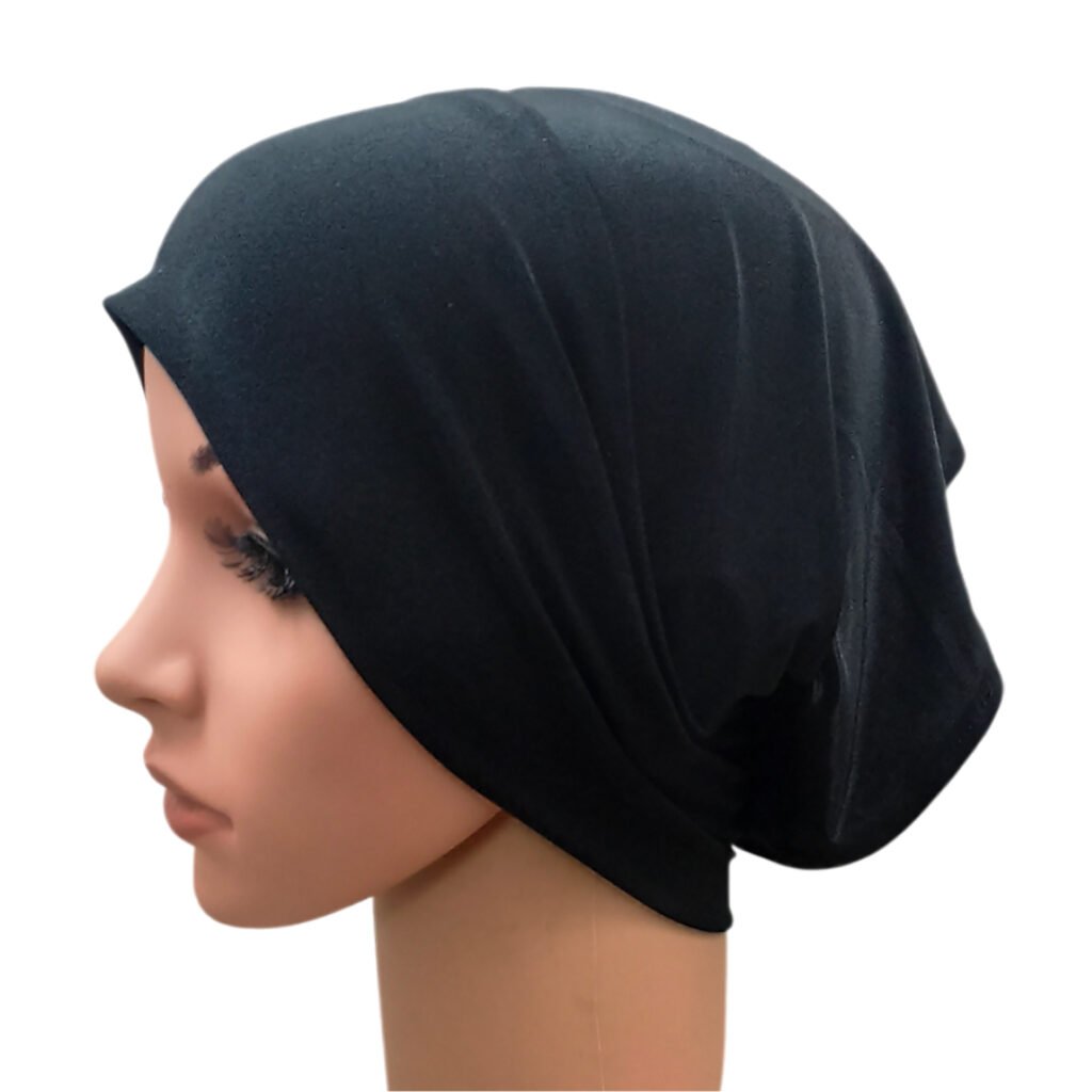 Side profile of a mannequin wearing a classic black Tube Cap Under Scarf made from premium stretch cotton jersey hosiery fabric.